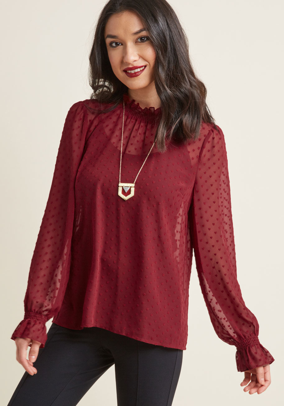 How's about a romantic blouse for your next dinner date? This style from our ModCloth namesake label flaunts endearing vintage-inspired details, like smocking at its high neckline and long sleeve cuffs, textured hearts patterned all over, and a blissful b by MCT1499
