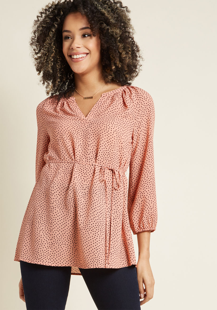 MCT1588 - When an unexpected outing arises, what's a gal to wear? This dusty rose tunic from our ModCloth namesake label is an instinctive option, for its notched neckline, cropped sleeves with elasticized cuffs, slim sash, and black-dotted crepe fabric are a cinch