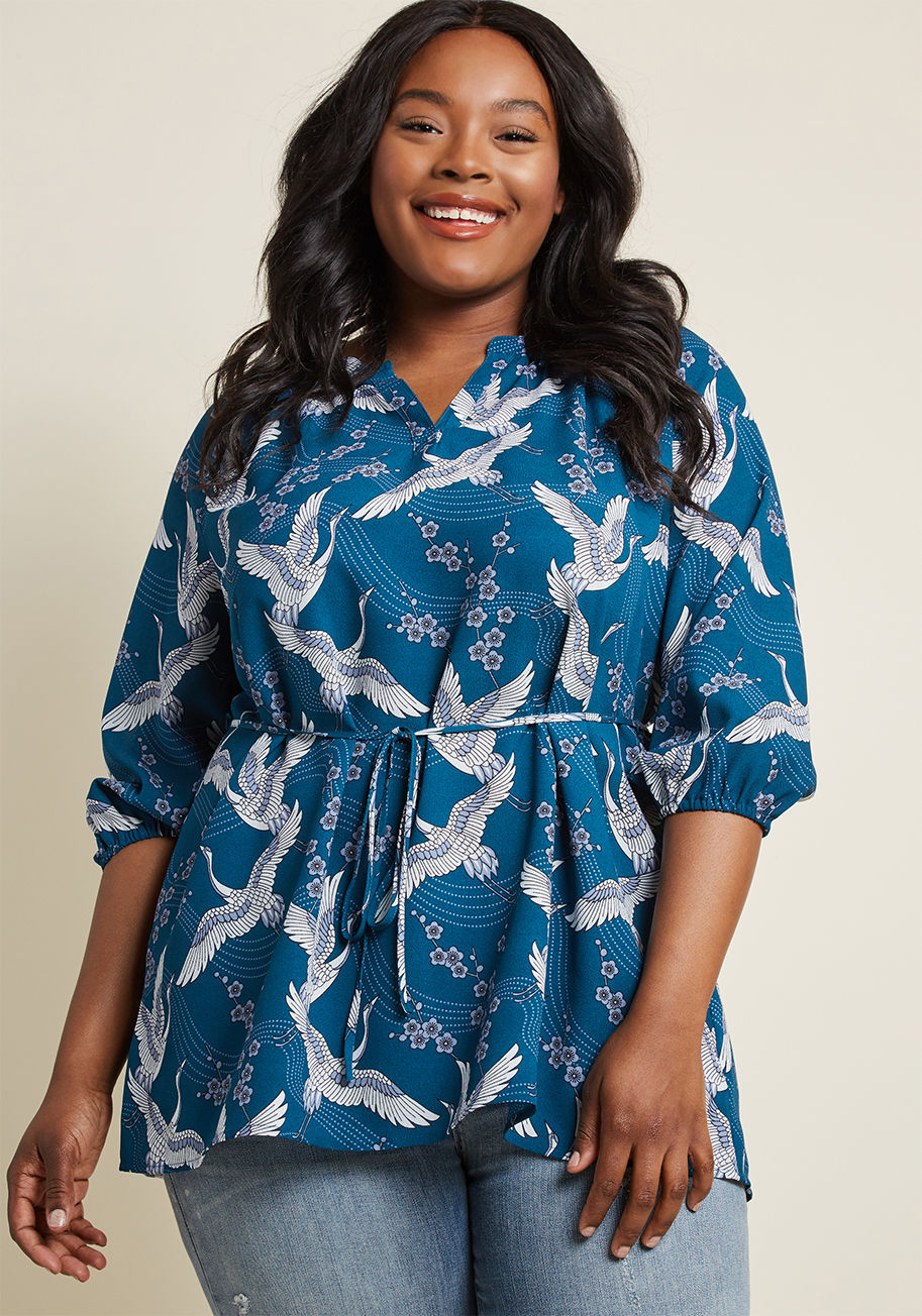 MCT1588A - When an unexpected outing arises, what's a gal to wear? This teal tunic from our ModCloth namesake label is an instinctive option, for its notched neckline, cropped sleeves with elasticized cuffs, slim sash, and crane-patterned crepe fabric are a cinch to