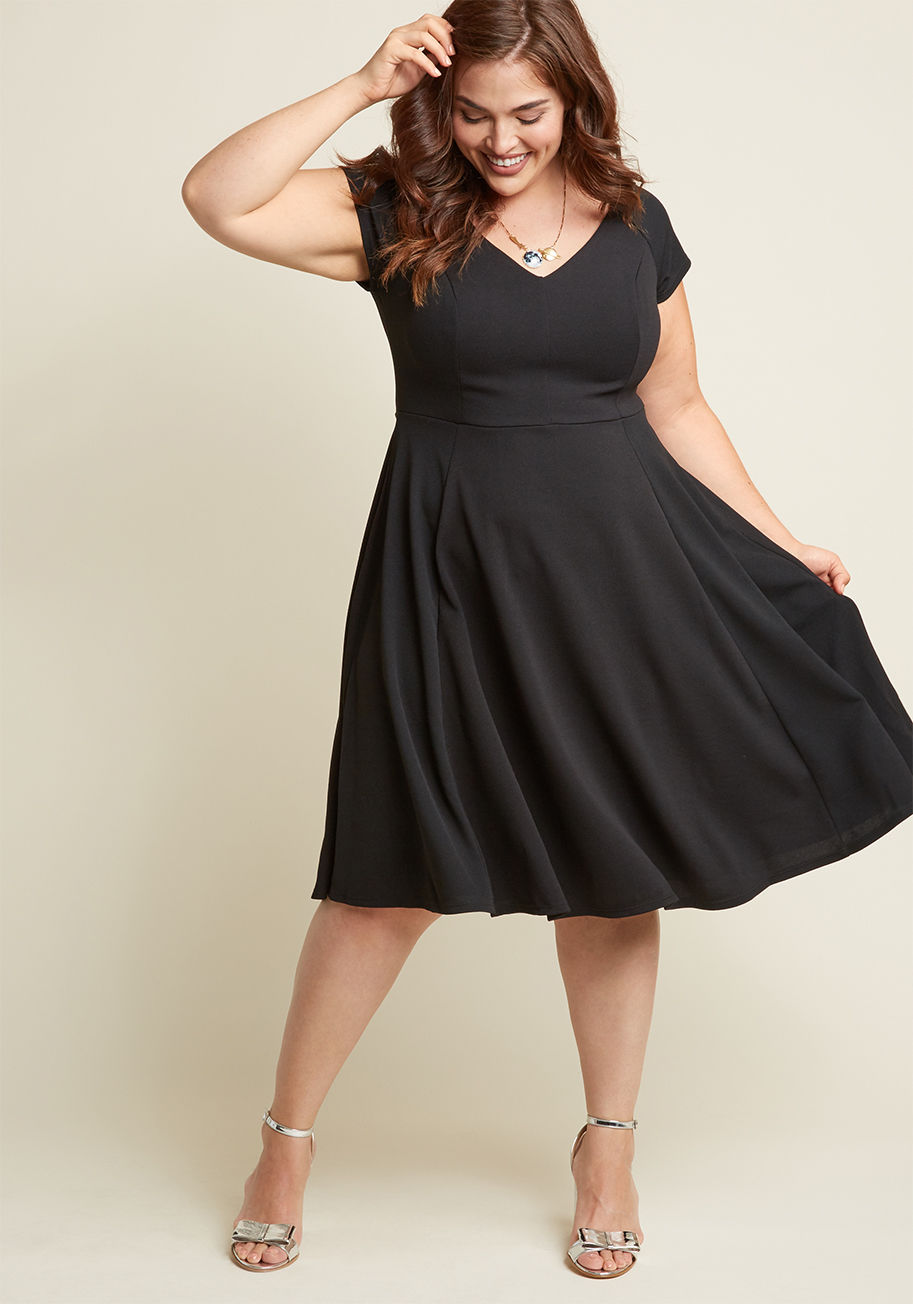 MDD1143 - When your love offers to take you anywhere you wish, you let this black dress dictate the flavor of the evening. The V-neckline, princess seams, cute cap sleeves, and updated stretch knit fabric of this textured, ModCloth-exclusive darling could mean anyt