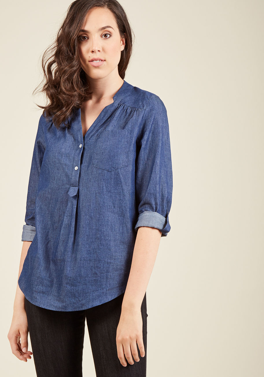 MDT1107 - When you want a work wardrobe that&rsquo;s subtle, stylish, and a bit romantic, make this chambray blouse your business! Everyone will want to copy the modestly marvelous style of this ModCloth-exclusive top - its gathered shoulders, low collar, and iride