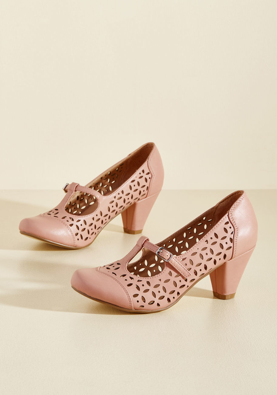 Milan - When deciding on these pink pumps for the day's look, you don't just choose the sassy T-straps, collection of cutouts, and tapered, mid-height heels of this pair from Chelsea Crew - you also appoint an air of alluring, vintage-inspired flair to wherever t
