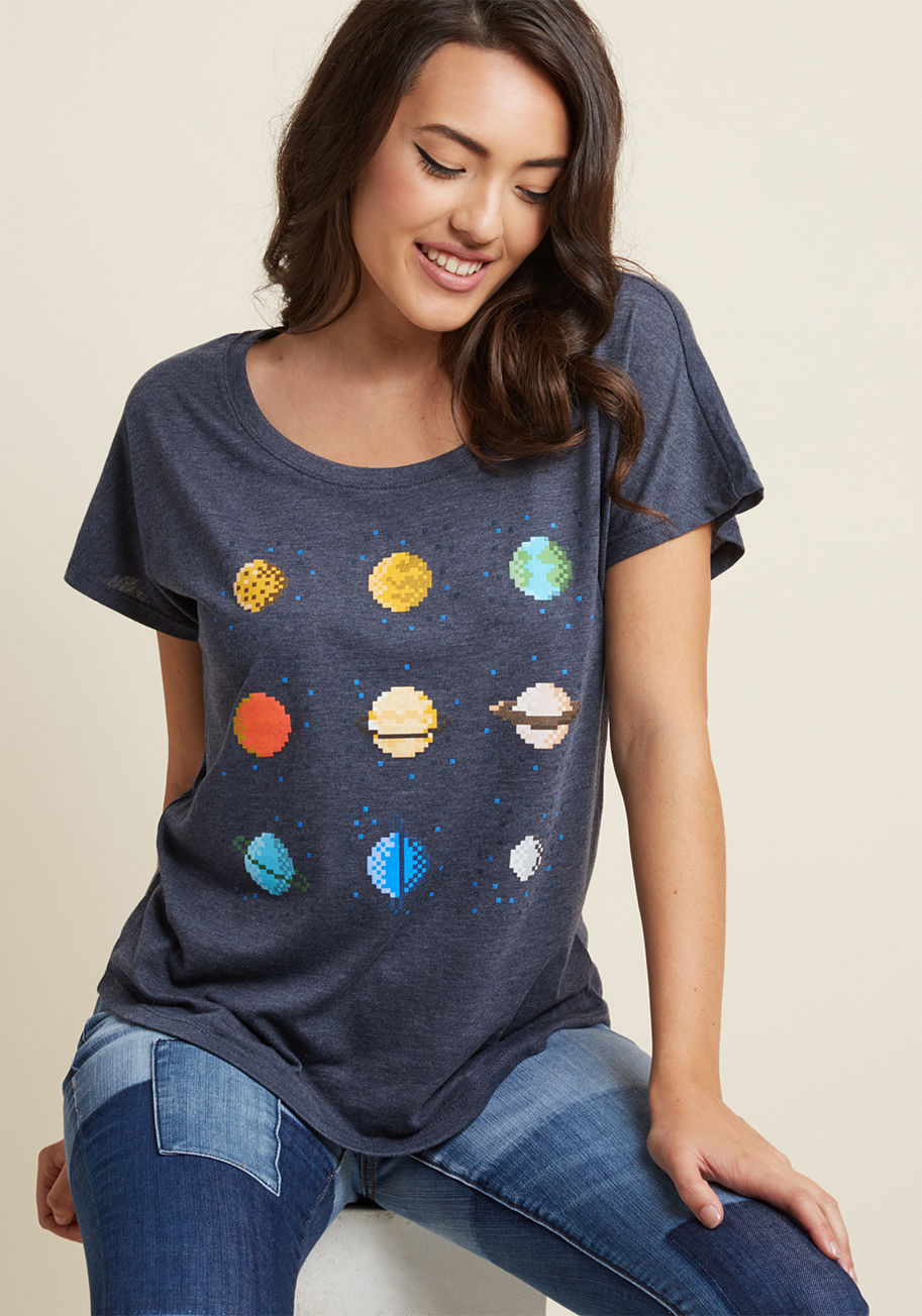 Pixel Planets - Your style will rank high-as-the-sky as soon as this heather blue dolman T-shirt is introduced into the game! With a wide neckline and an 8-bit screen print of all nine pixelated planets, this soft jersey knit tee is a point up for team geek chic.
