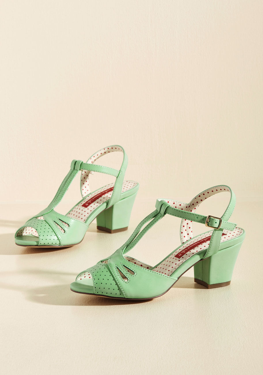 Reanna - We dare you to try sitting still with these mint block heels by B.A.I.T. Footwear on your feet! In no time flat, your peep toes will start tapping and soon, you'll be full-on grooving the T-straps, perforations, and cutouts of this faux-leather pair. Have