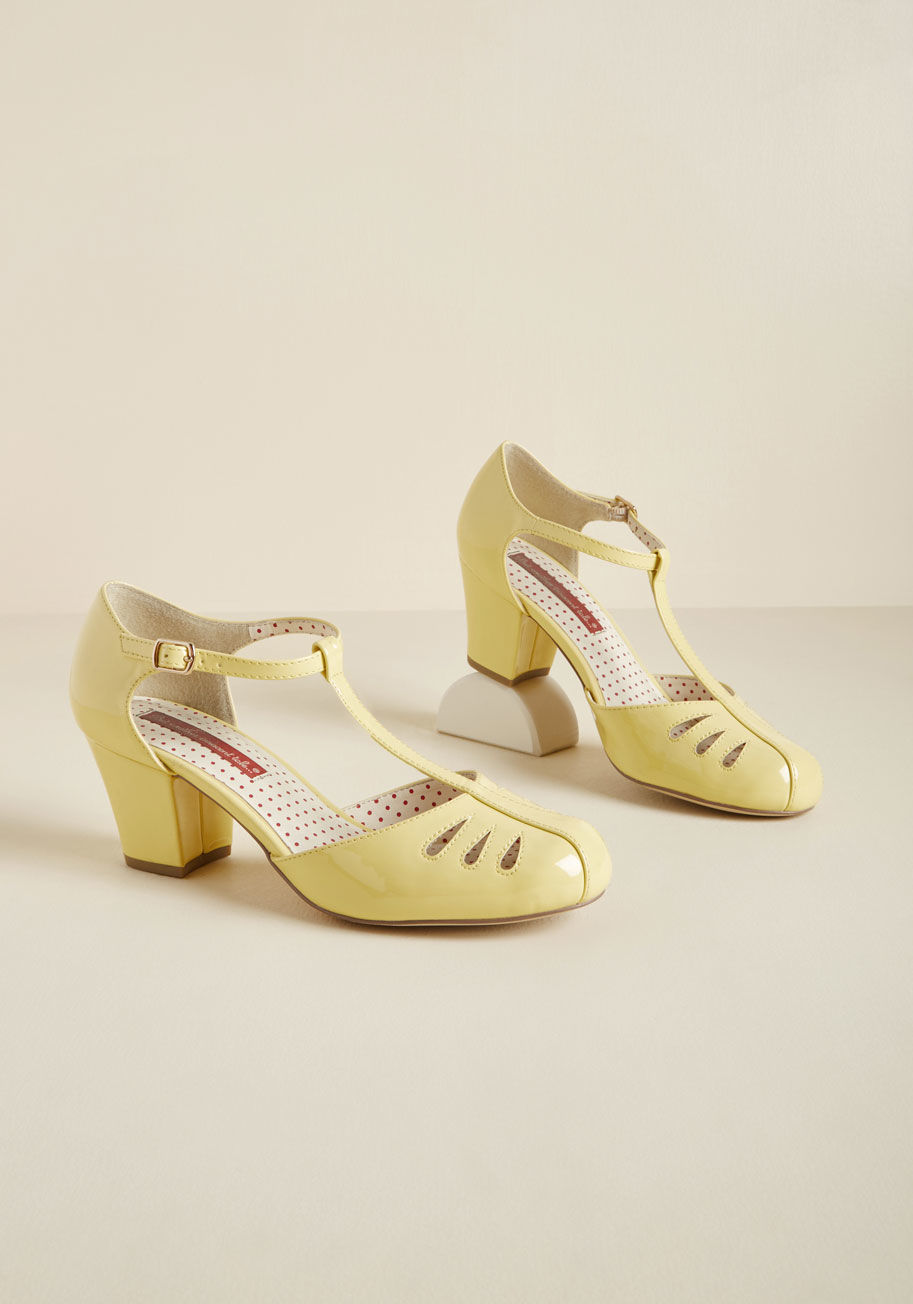 Robbie - Whoa there, lady thang, we know you&rsquo;re excited about these sleek yellow heels by B.A.I.T. Footwear, but let&rsquo;s try to keep it cool. We give you full permission to internally scream over the sturdy mid heel and teardrop-shaped toe cutouts of the
