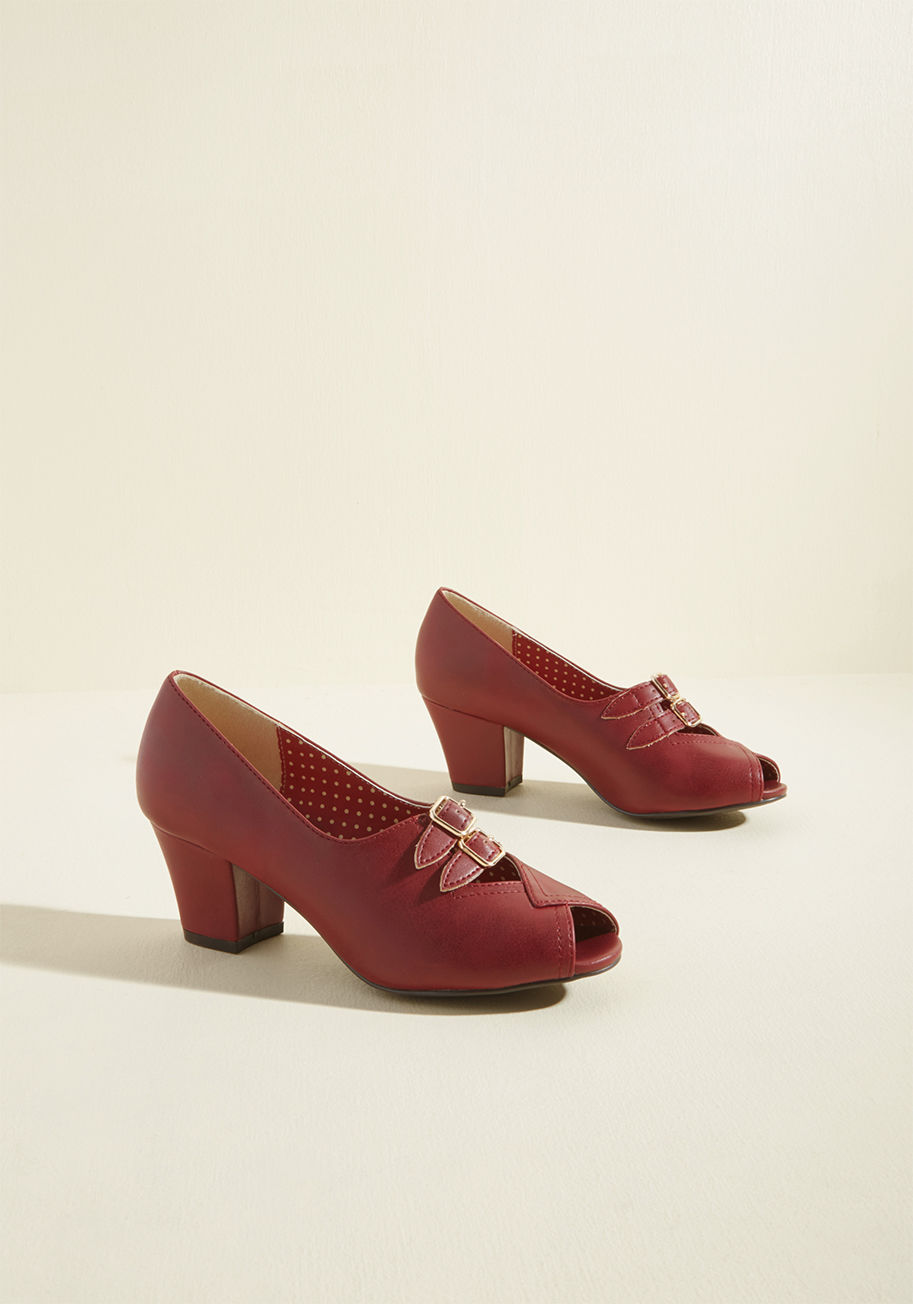 Romona - The next time you get your feet moving, it'll be with these burgundy block heels tapping atop the parquet! A faux-leather pair by B.A.I.T. Footwear, these vintage-inspired kicks feature golden top buckles, overlapping peep toe details, and singular style 