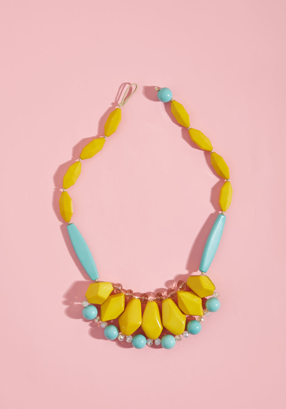 Even when your chosen outfit for the day is on the simple side, this beaded necklace ups the intrigue and celebrates your spunky taste! Combining shiny facets, glossy finishes, and a palette of curry, aqua, champagne, and iridescent hues, this geometric a by RSN0021-YLMT