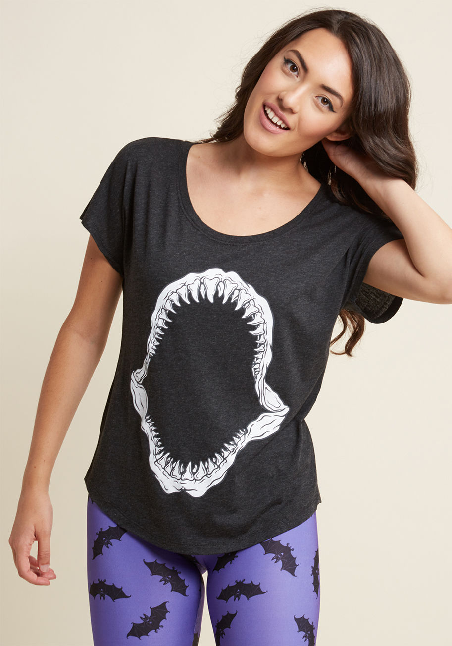 SHARK BITE - Pair up this grey graphic T-shirt with a winning look stat - and that's an order. Just kidding! But, we do want you to know you're free to style the wide neckline, seamless long sleeves, and shark bone print of this casual tee with imaginative ease.