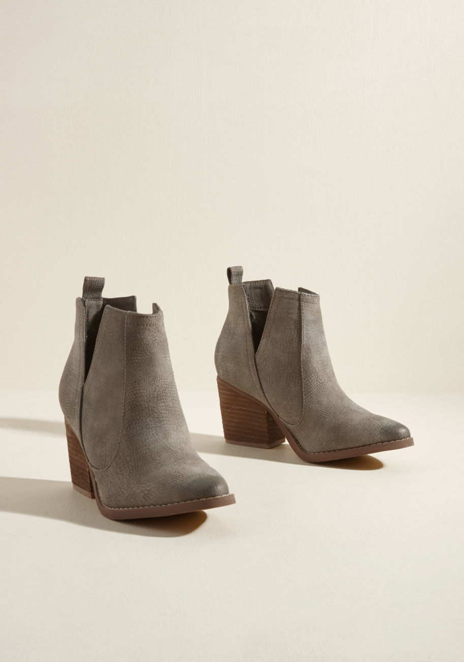 Shea - Fashion fads may come and go, but these grey booties are a pair you can rely on for seasons to come! A pair of V-shaped vents add interest to the croc-textured uppers of these faux-leather beauties, while their supportive stacked heels lend comfort and a 