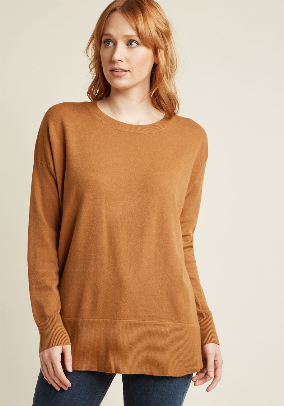 Your challenge? Create a look that's comfy, cuddly, and downright cozy. The solution? This tan pullover, obviously! Lightweight knit fabric and an inviting, oversized fit make this sweater an optimal layering piece, so consider the obstacle of crafting th by T2220