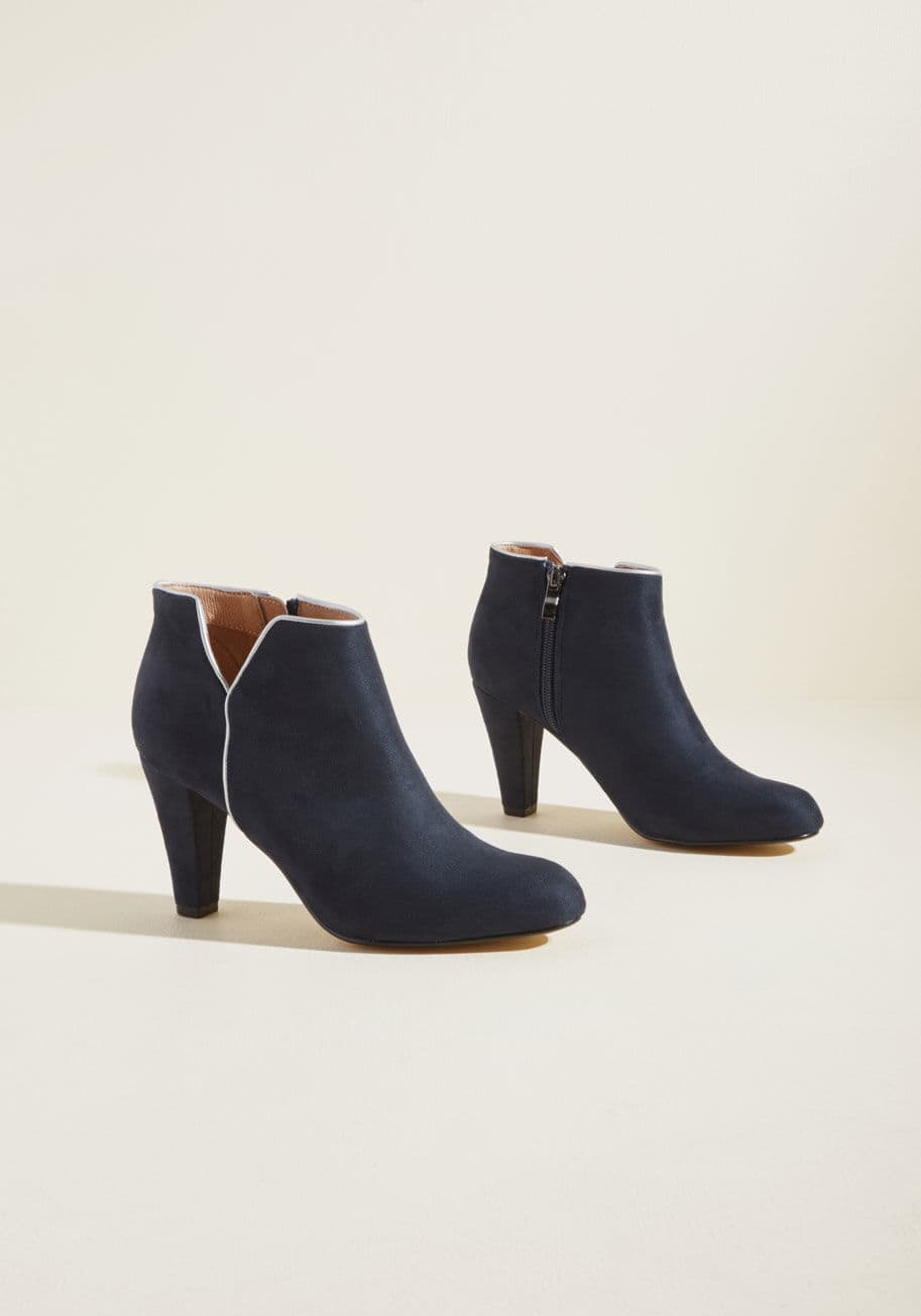 Tiffany - One look at these navy blue booties from Chelsea Crew will give passersby a sense of the scope of your sophisticated style! Flaunting navy blue faux suede, silver faux-leather trim, notched sides, and tapered heels, this leather-lined pair is sleek, chic,