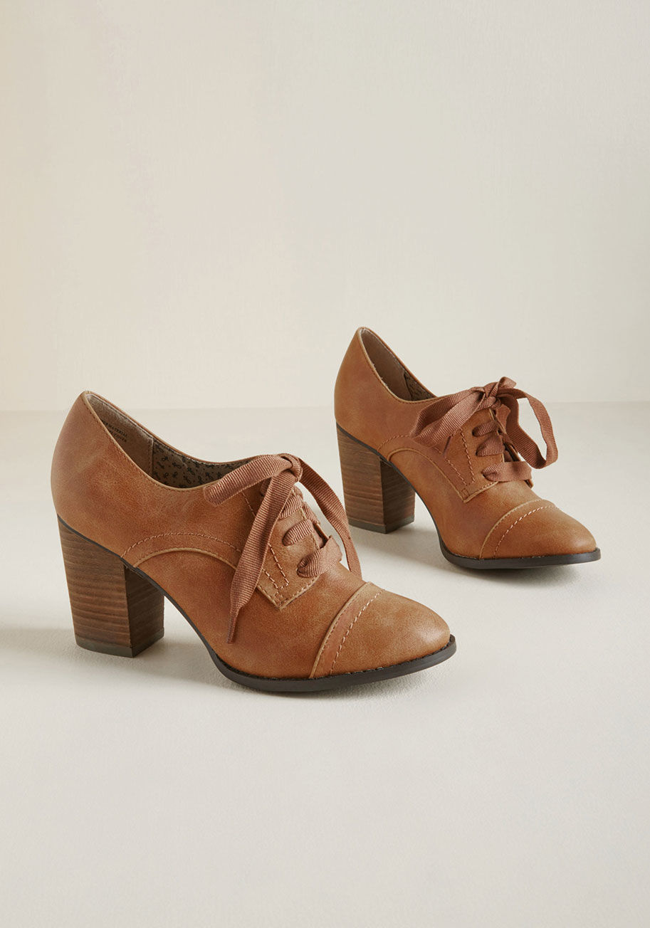 Tipsy - Which came first - your spot-on style or these Oxford-inspired heels by Restricted? Our guess is the former, but this faux-leather pair's cognac color, ribbon laces, and block heels appear as though they've been a part of your original look since the begi