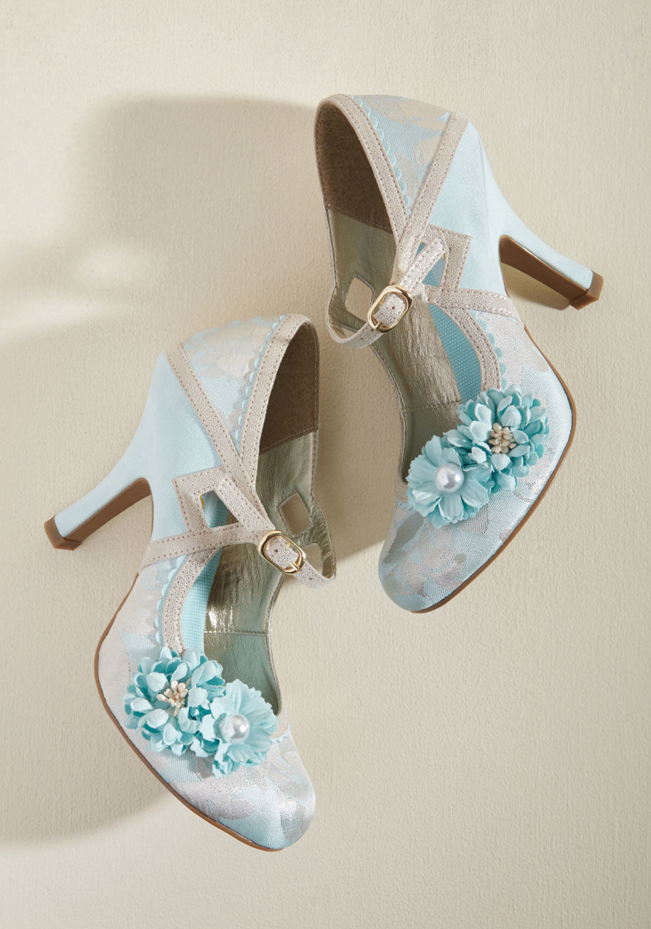 Yasmin - Let your imagination scamper freely while your ensemble joins along with these unique heels by Ruby Shoo! Whimsical and wonderful, these metallic rose and silver Mary Janes flaunt scalloped seaming, triangular cutouts, brocade accents, and a beautiful flo